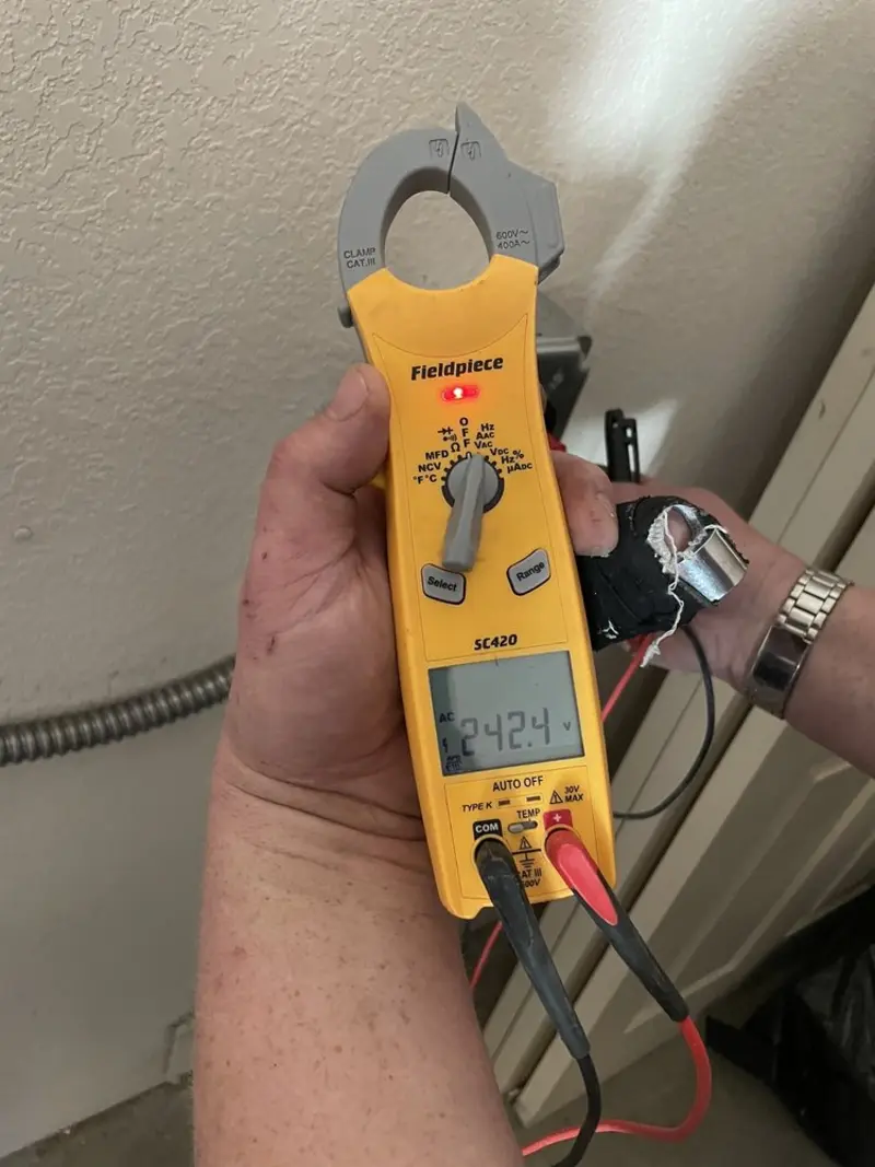 Voltage testing with clamp meter during Recessed Lighting Installation in Ashford